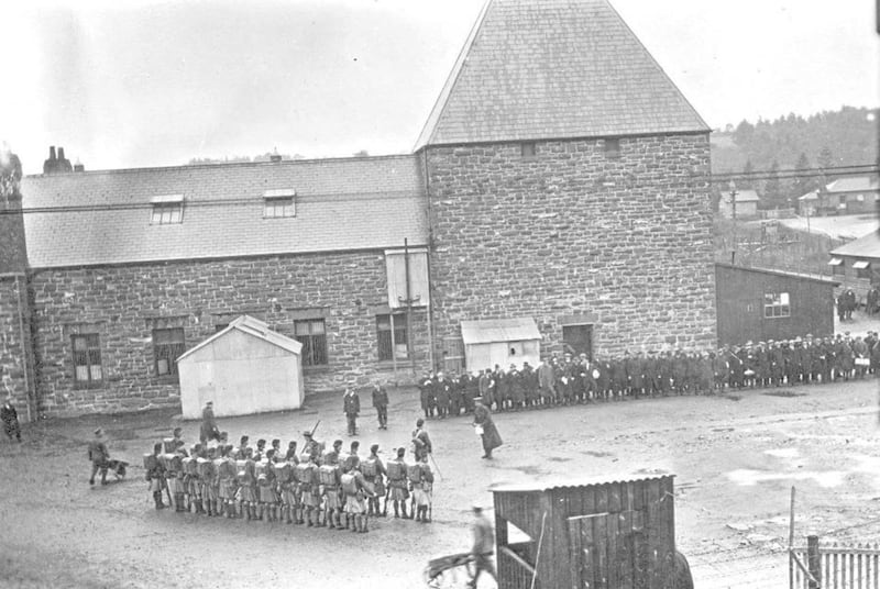 Interned German prisoners at the disused distillery in Frongoch during the First World War. The south camp was located at the distillery and there is now a school built on this site, while the north camp&#39;s location is now farmland. 