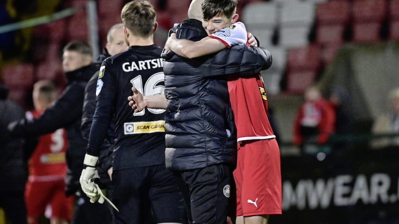 Cliftonville manager Paddy McLaughlin celebrates with Sean Moore at the end of yesterday&#39;s 2-1 win over Larne 