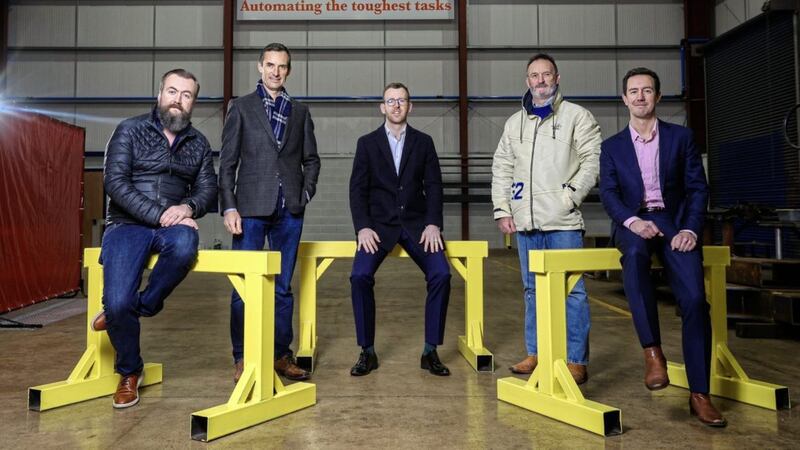 Investors Enda Ivanoff and Bertie Notley (standing) with Clarendon&#39;s Stuart Gaffikin (centre); and Tribe Technology&#39;s Michael Morrow (left) and Eric Hampel (right), at the group&#39;s Mallusk base. 