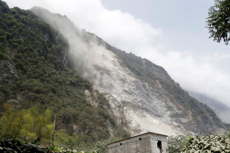 A cloud of dirt follows a mudslide in Hualien (Chiang Ying-ying/AP)