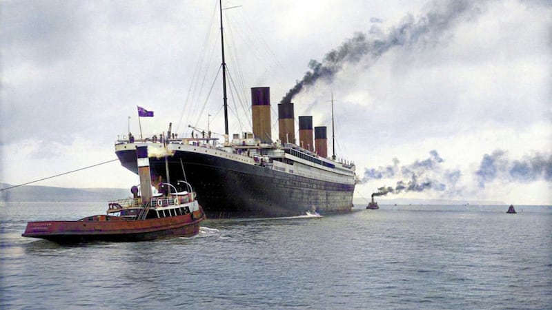 RMS Titanic pictured by official Harland and Wolff photographer Robert Welch leaving Belfast on April 2 1912, with two of the five tugboats required to guide the ill-fated vessel out of Belfast Lough visible 