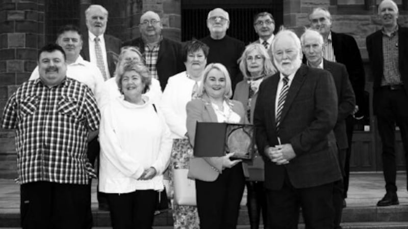 Pat McArt (pictured right) with his wife, Rosie (left) and family and friends was honoured with a civic reception earlier this year by former mayor, Sandra Duffy (centre). 