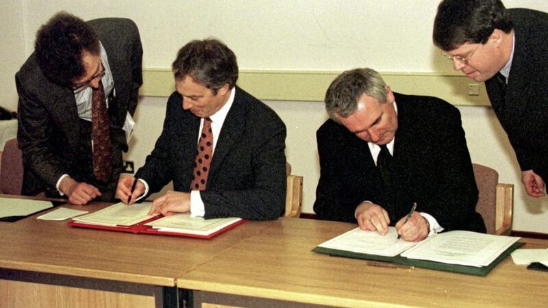 British Prime Minister Tony Blair and Taoiseach Bertie Ahern sign the Good Friday Agreement in 1998. Photo: Dan Chung. 