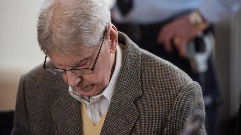 ACCUSATIONS: 94-year-old former SS guard at the Auschwitz death camp Reinhold Hanning waits for the start of his trial in Detmold, Germany, yesterday. Mr Hanning faces trial for 170,000 counts of accessory to murder, the first of up to four cases being brought to court this year in an 11th-hour push by German prosecutors to punish Nazi war crimes PICTURE: Bernd Thissen/Pool Photo via AP) 