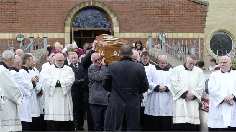 Mourners gathered at Corpus Christi Church in west Belfast yesterday for the funeral of Fr Aidan Denny Picture: Hugh Russell 