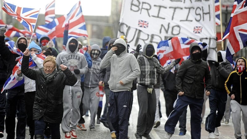 Loyalists arrive at Belfast City Hall in 2012 for a protest against a decision to stop flying the union flag from the building every day 