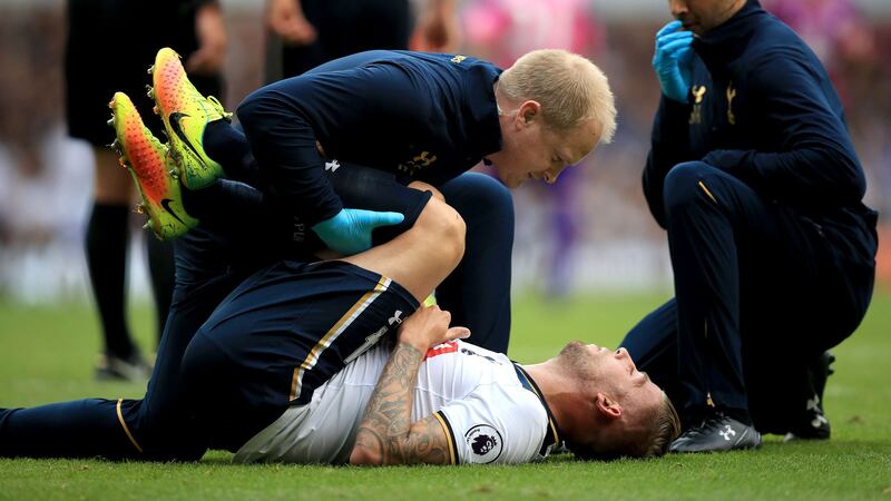 Tottenham Hotspur's Toby Alderweireld is treated for an injury