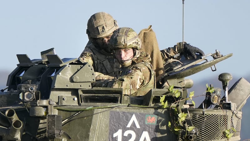 The Prince of Wales, right, rides in an armoured vehicle while on a training exercise on Salisbury Plain (Andrew Matthews/PA)