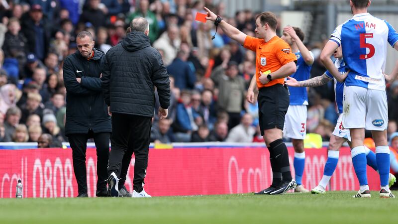 Blackburn Rovers manager John Eustace is shown a red card