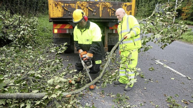 A huge clear-up operation continued yesterday including the removal of trees from Upper Dunmurry Lane in Belfast. Picture by Mal McCann 