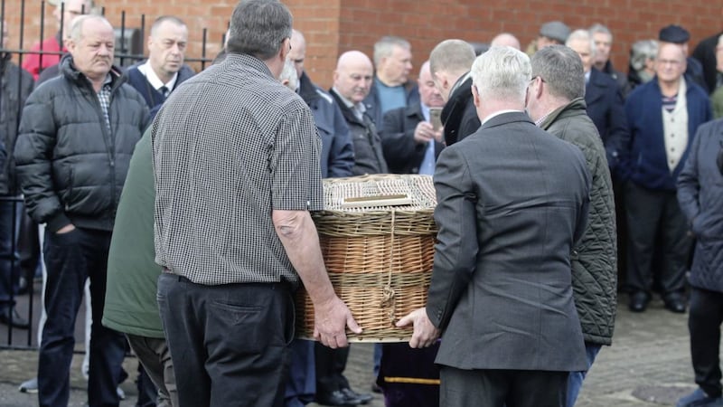 The remains of former Sean Garland arrives at the Lower Falls Social club. Picture by Ann McManus 