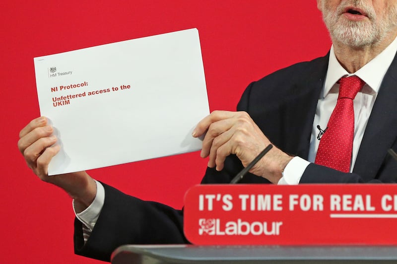 Labour Party leader Jeremy Corbyn holds up a leaked document relating to Northern Ireland, during a press conference in central London, whilst on the General Election campaign trail. Picture by Jonathan Brady/PA Wire&nbsp;