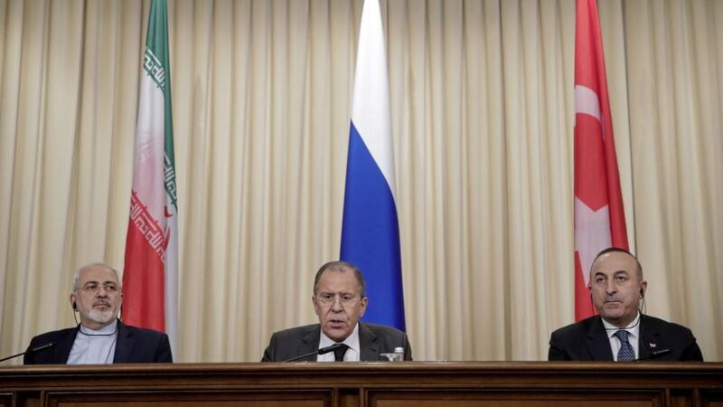 From left, Iranian foreign minister Mohammad Javad Zarif, Russian foreign minister Sergey Lavrov and Turkey&#39;s foreign minister Mevlut Cavusoglu following talks in Moscow 