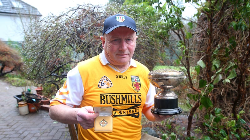 GOLDEN DAYS: Former Antrim football star John McKiernan displays the last two plaudits of his career &ndash; an Antrim senior club championship medal won with L&aacute;mh Dhearg at 40 years of age in the infamous 1992 &lsquo;walkover&rsquo; final and a Player of the Year cup presented upon his county retirement four years previous.<br />Picture by Mal McCann &nbsp;