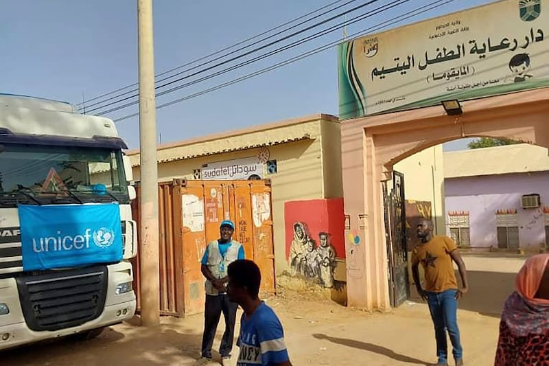 A truck carrying humanitarian assistance from the UN children’s agency stands in front of the Foster Home for Orphans in Khartoum, Sudan, in May