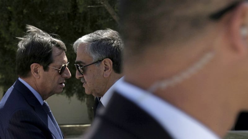 Cypriot President Nicos Anastasiades, left, and breakaway Turkish Cypriot leader Mustafa Akinci, right 
