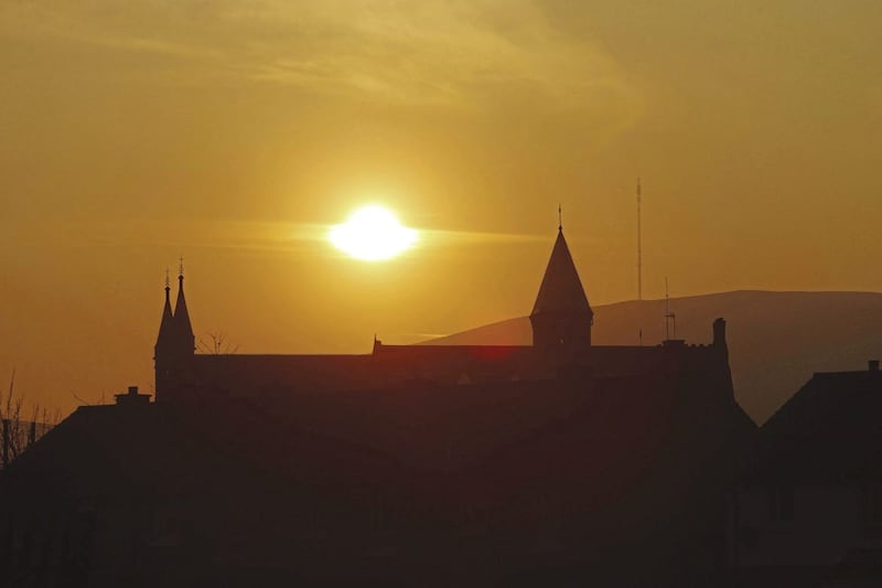 Dusk: Sunset between the spires Clonard Monastery in west Belfast Picture Mal McCann. 