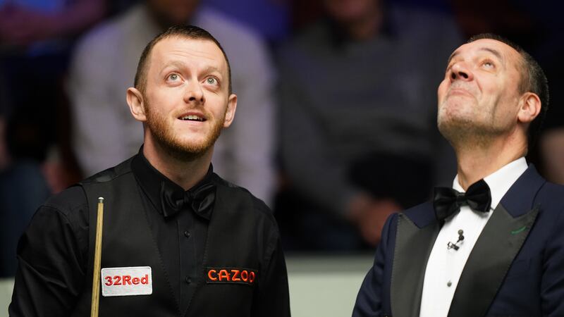Mark Allen and referee Olivier Marteel during his match with Fan Zhengyi on Monday evening at the Cazoo World Snooker Championship at the Crucible Theatre, Sheffield Picture: Mike Egerton/PA