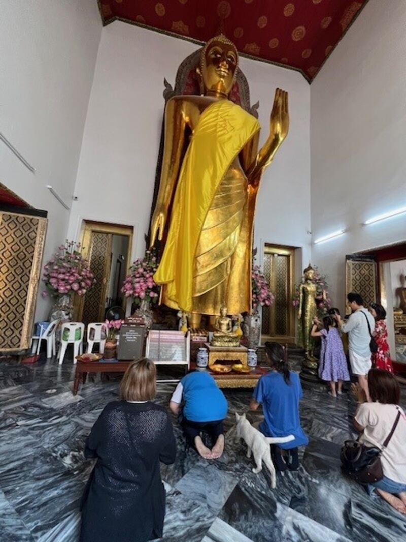 Visitors are encouraged to pay their respects to statues of Buddha