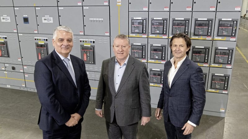 Vertiv global chief executive Giordano Albertazzi (right) and its E I business managing director Philip O&rsquo;Doherty (centre) with Invest NI&#39;s interim chief executive Mel Chittock at the US company&#39;s new operation at Campsie 