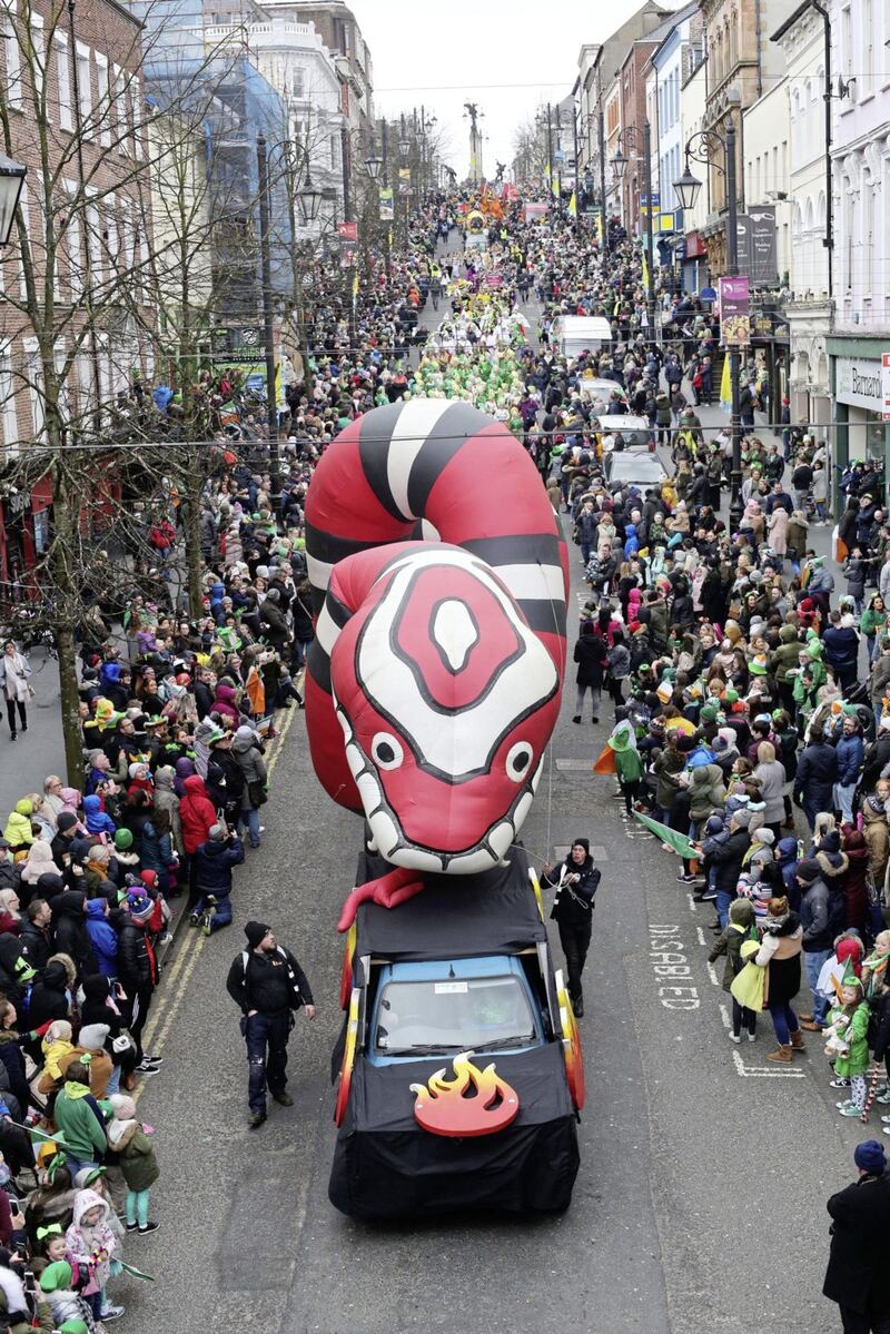 In Derry, 20,000 spectators wrapped up against the elements to watch a colourful cascade of characters spill down Shipquay Street and weave their way through the city centre.