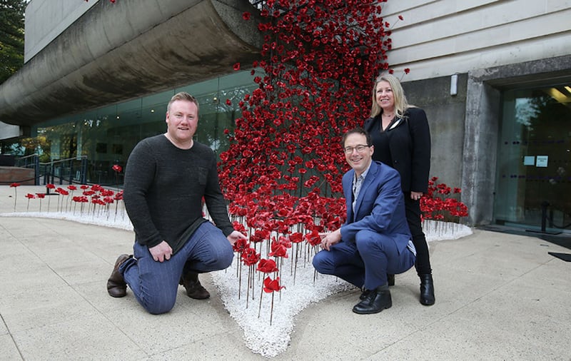 Pictured at the sculpture are, from left to right,  Artist Paul Cummins, Designer Tom Piper and Kim Mawhinney, Head of Art, National Museums NI&nbsp;