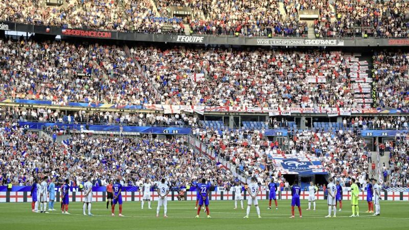 English, French players and the crowd respect a minute&#39;s silence during the International Friendly at the Stade de France, Paris on Tuesday. Press Association 