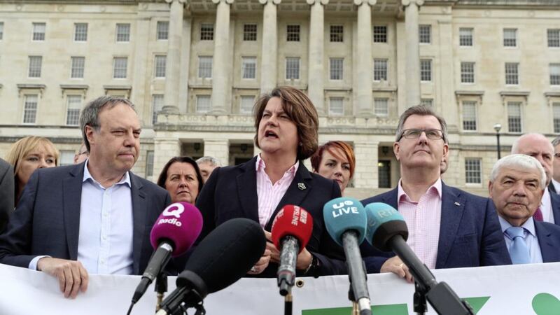 DUP leader Arlene Foster speaks to the media as she unveils a banner with party colleagues including Nigel Dodds (left) and Sir Jeffrey Donaldson (second right) outside Parliament Buildings at Stormont in Belfast. The Government has acknowledged the deep frustration of the public in Northern Ireland as the region reached an unwanted milestone for non-governance. PRESS ASSOCIATION Photo. Picture date: Tuesday August 28, 2018. On Tuesday the region notched up 589 days since the powersharing executive collapsed - passing Belgium for the world&#39;s longest peacetime period without a properly functioning government. See PA story ULSTER Politics. Photo credit should read: Liam McBurney/PA Wire. 
