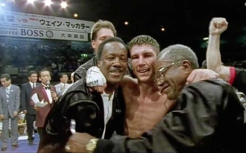 Wayne McCullough celebrates with coaches Eddie Futch and Thell Torrence after defeating Yasuei Yakushiji in Japan 25 years ago. Screengrab courtesy of DoubleBand Films