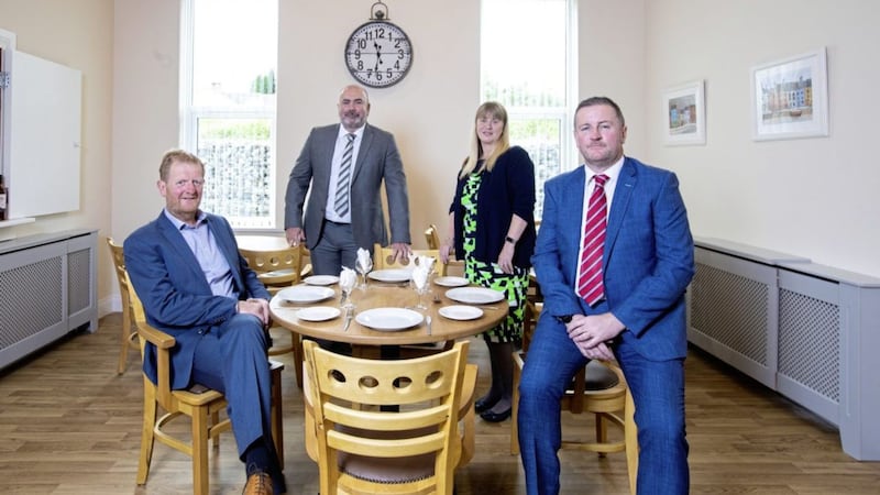 At the new Bardan Cottage in Bessbrook are (from left) owners Peter Graham and Liam Lavery with Louise Harte (registered manager) and Conor McGivern (business manager at Danske Bank). Picture: Brian Thompson 