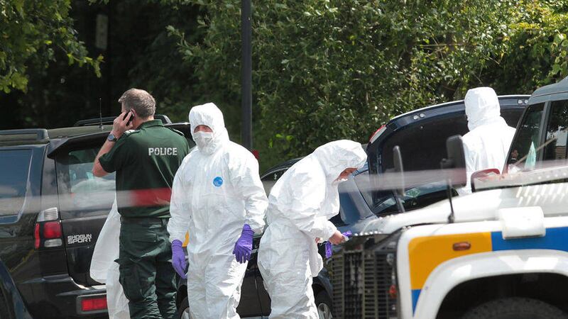 Police and forensics at the scene where a bomb was found under the car of a serving PSNI officer in Eglinton. Pictures by Margaret McLaughlin 