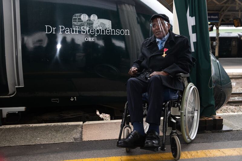 Dr Paul Stephenson next to the train bearing his name (Andrew Matthews/PA)
