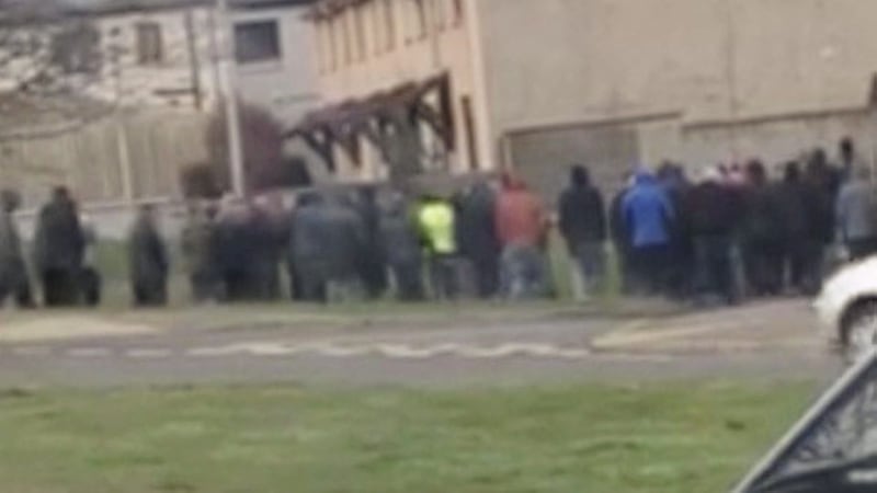 Around 40 members of the North Down UDA have staged a &#39;show of strength&#39; in Bangor following searches of loyalist Dee Stitt&#39;s home. 