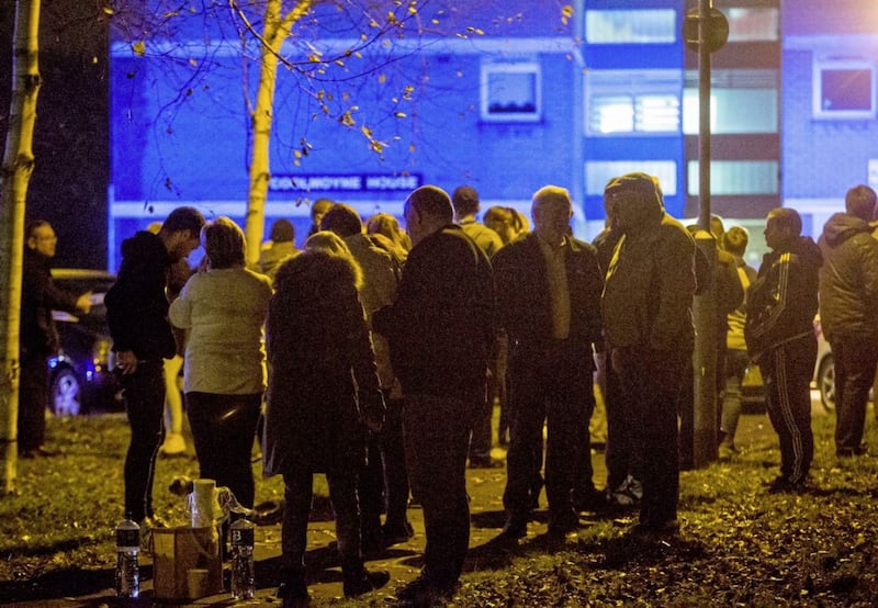 Residents gather outside Coolmoyne House in Dunmurry<br />&nbsp;