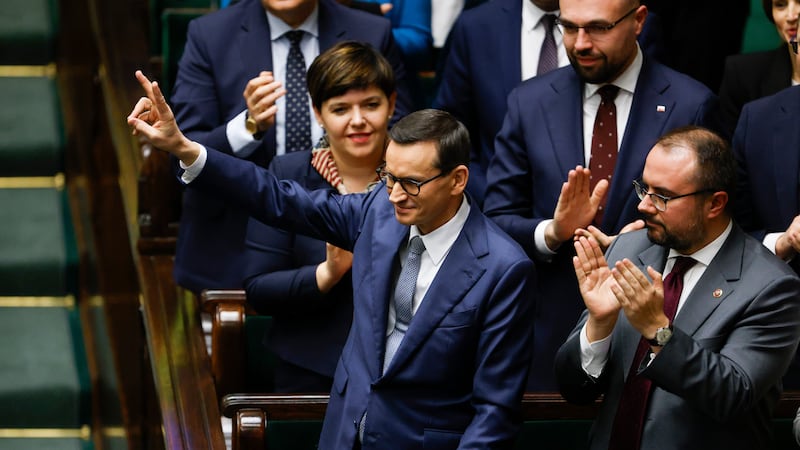 Poland’s Prime Minister Mateusz Morawiecki reacts after losing confidence vote at the parliament (AP Photo/Michal Dyjuk)