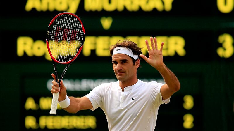 Roger Federer celebrates victory over Andy Murray during day eleven of Wimbledon