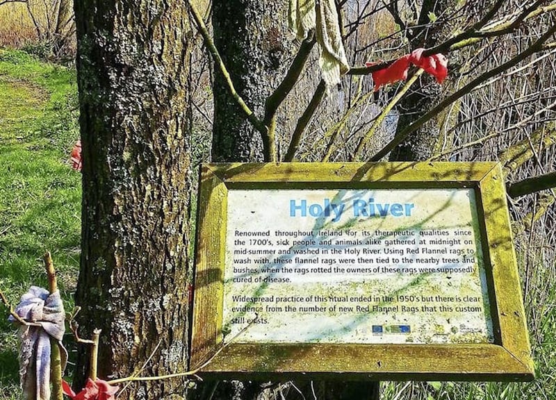 Red rags hang from trees at a sign near the &#39;Holy River&#39; in Washingbay, Co Tyrone 