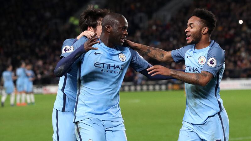 Manchester City's Yaya Toure celebrates with Raheem Sterling after opening the scoring in Monday's Premier League game against Hull at the KCOM Stadium<br />Picture by PA &nbsp;