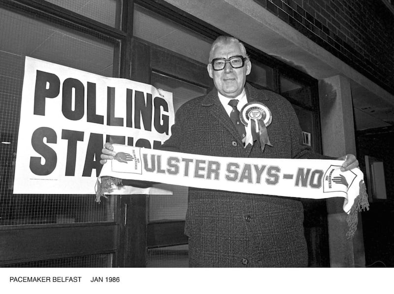 Ian Paisley with an Ulster Says No banner in January 1986. Picture Pacemaker 