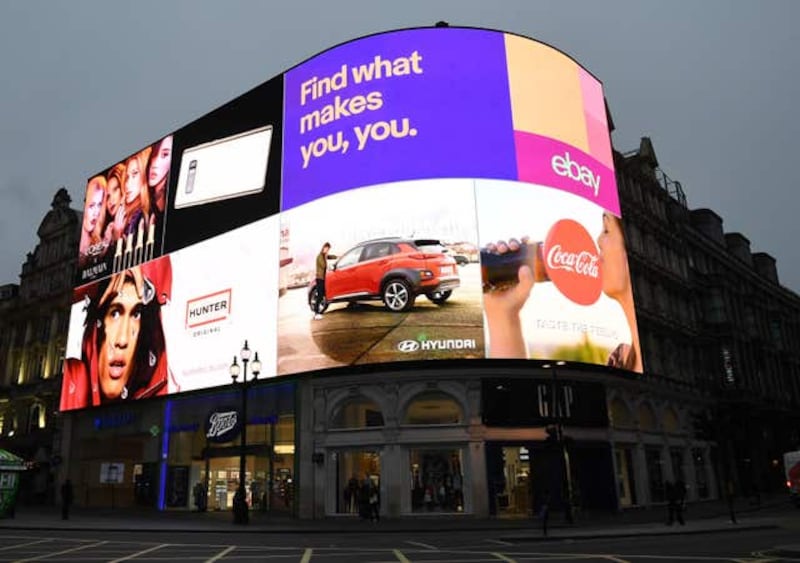 The advertising screens at Piccadilly Circus in central London are switched on for the first time in nine months after the electronic hoardings were replaced with a state-of-the-art screen measuring 790 square metres.