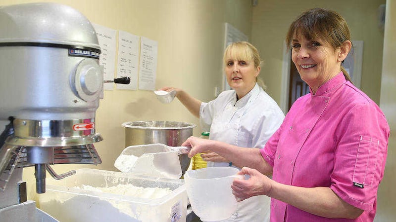 Anna Taggart right and her assistant Claire Crean mix kit up at Anna&#39;s business, Yummy Bakes in Belfast Picture by Hugh Russell 