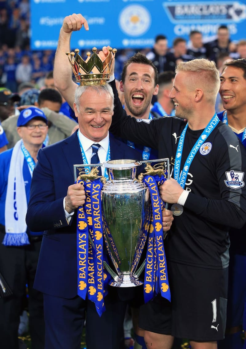 Claudio Ranieri, left, celebrates Leicester's Premier League title with Christian Fuchs, centre, and Kasper Schmeichel