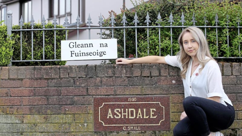 Medb N&iacute; Dh&uacute;l&aacute;in placed the Irish language sign at her grandmother&#39;s home in Randalstown. Picture by Philip Walsh 