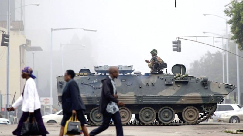 Armed soldier patrol a street in Harare, Zimbabwe PICTURE: AP 