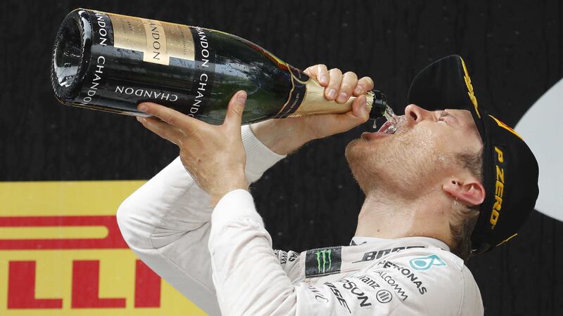 Mercedes driver Nico Rosberg celebrates on the podium after winning the Chinese Grand Prix at the Shanghai International Circuit on Sunday<br />Picture by AP&nbsp;