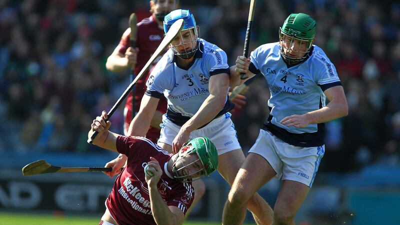 Ruairi Og's Christy McNaughton goes down under the challenge of Na Piarsaigh's Kieran Breen and Kieran Kennedy during Thursday's All-Ireland Club Hurling final at Croke Park <br />Picture by Seamus Loughran&nbsp;