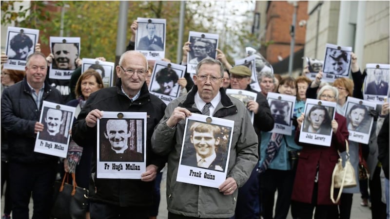 Patsy Mullen brother of Fr Mullen and Liam Quinn brother of Frank with families of Ballymurphy Massacre outside court Picture by Hugh Russell. 