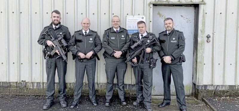 Simon Byrne posed with armed PSNI officers in Crossmaglen in December. Picture from Simon Byrne/ Twitter 