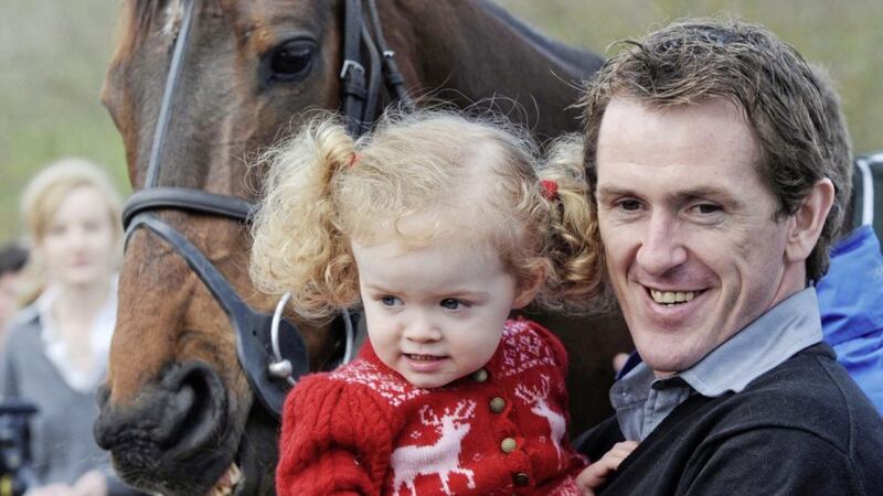 Jockey Tony McCoy with Don&#39;t Push It and daughter Eve (aged two) during the parade at The Plough Inn at Ford Temple Guiting. McCoy riding Don&#39;t Push It raced to glory in the John Smith&#39;s Grand National to give the champion jockey his first win in the great race at the 15th attempt. Picture date: Sunday April 11 2010. Photo credit should read: Barry Batchelor/PA Wire. 