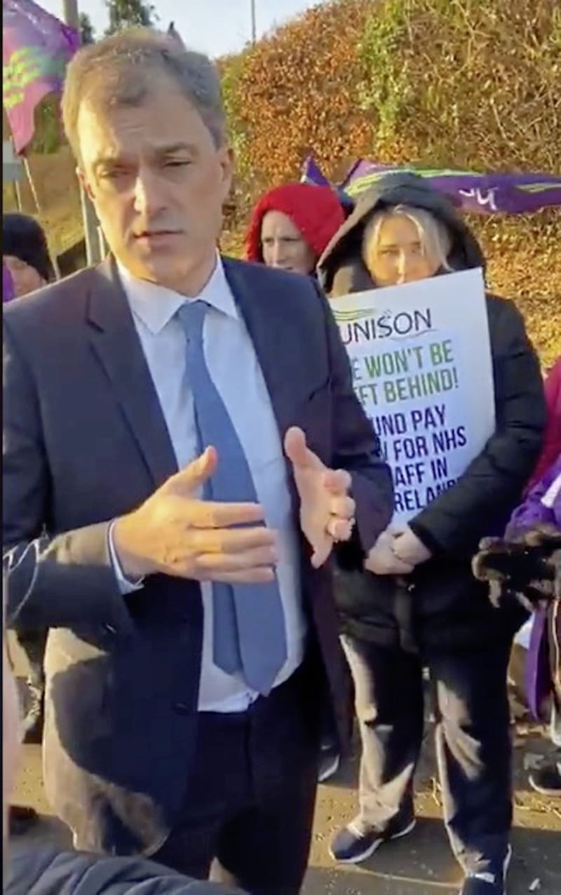 Secretary of State Julian Smith attended a picket line outside the Ulster Hospital in Dundonald earlier this month. Yesterday he spoke of his concern about the health crisis. 